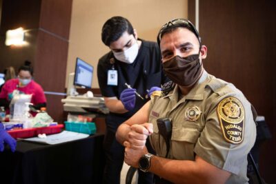 Senior Patrol Deputy Tony Vargas of Hidalgo County Sheriff’s Office receiving a vaccination at the conference center on Saturday.