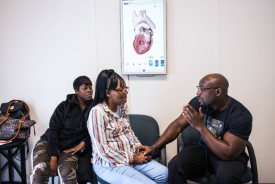 Dr. Foluso Fakorede speaks with a patient.