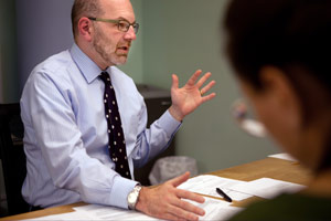 Craig Gurian, left, an attorney from The Anti-Discrimination Center who brought a fair housing lawsuit against Westchester County under the False Claims Act, works with colleague Heather Rogers, right, during a meeting in his office in New York, N.Y., on Oct. 23. (Melanie Burford for ProPublica)