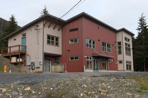 Planned as a technical center for the shareholders of the Cape Fox Corporation, this red-and-beige building off of the South Tongass Highway in Saxman, Alaska, sits empty. (Michael Grabell/ProPublica)